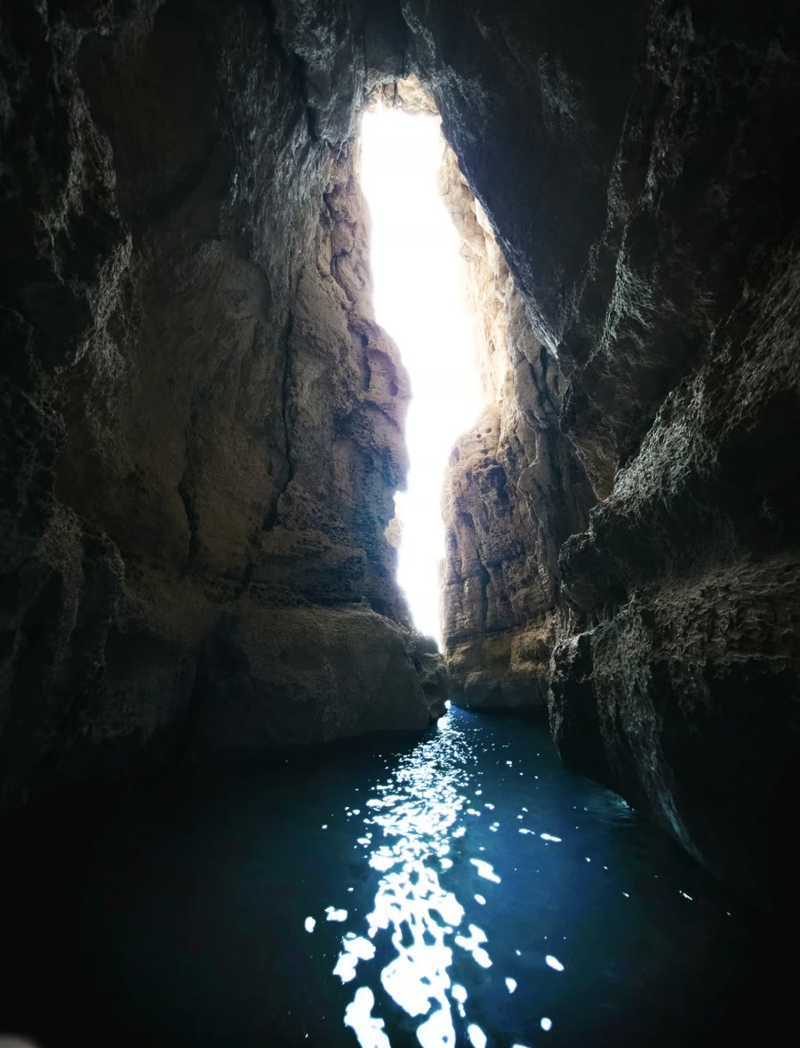 Light pouring into a narrow sea cave